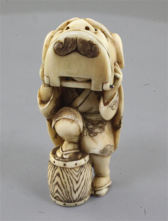 A Japanese ivory netsuke of a shishimai dancer, Meiji period, signed Nagatame, h. 5.1cm